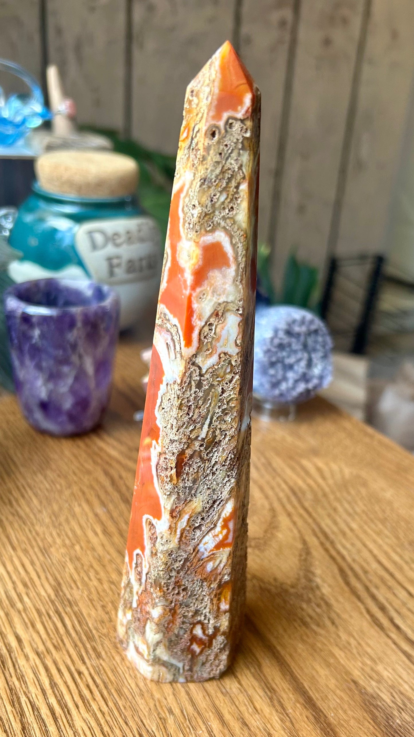 Decorative crystal on a wooden surface with blurred background