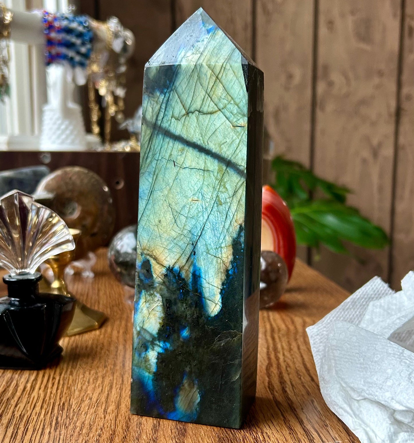 Crystal tower on a wooden surface with a blurred background