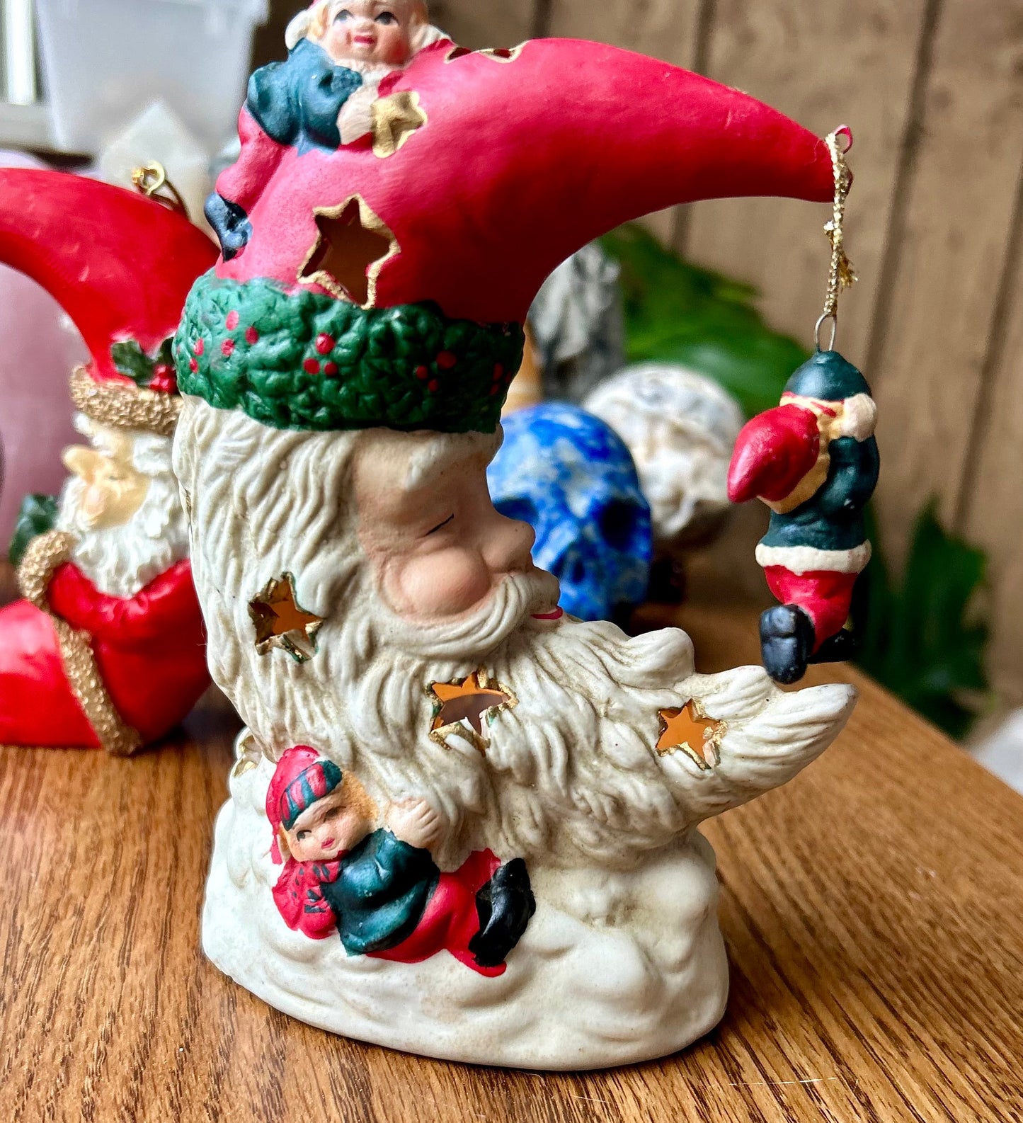 Decorative gnome figurine with colorful hat and accessories on a wooden surface