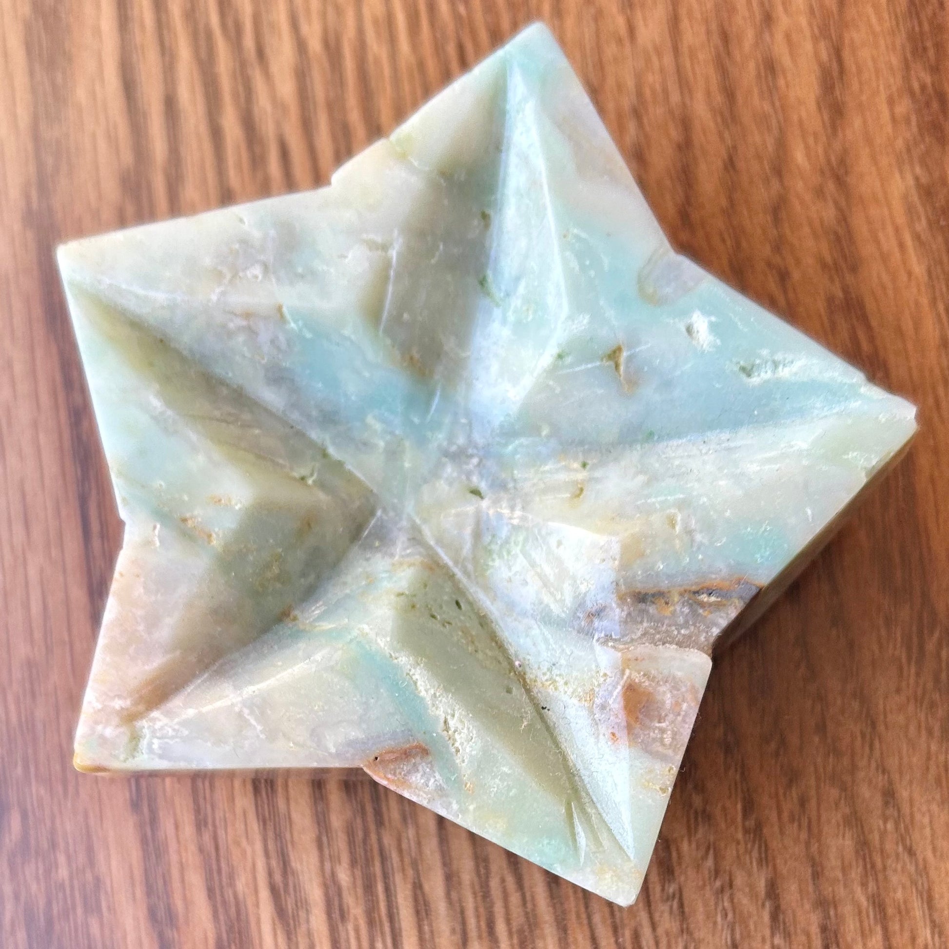 Star-shaped stone on a wooden surface