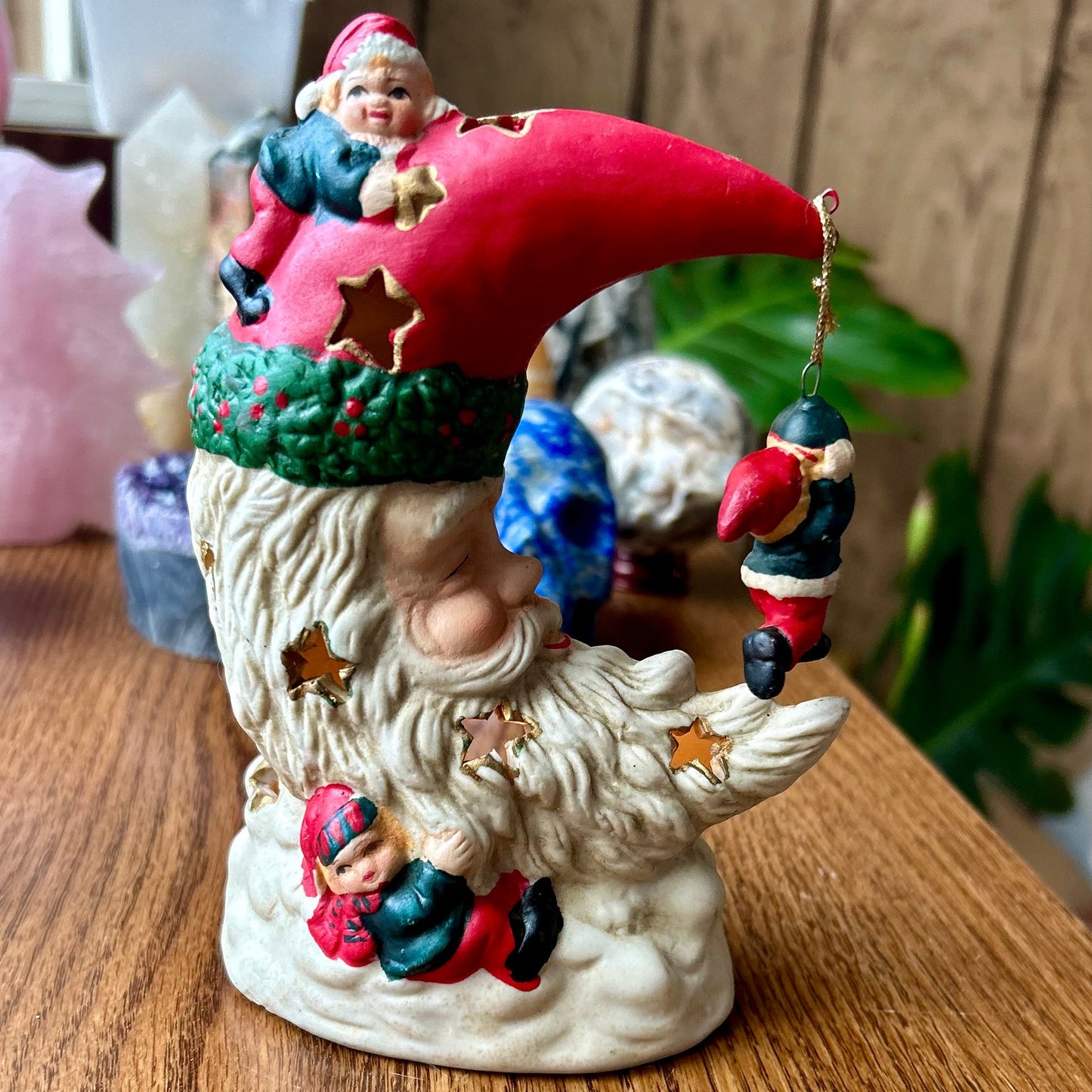 Decorative gnome figurine with a red hat on a wooden surface