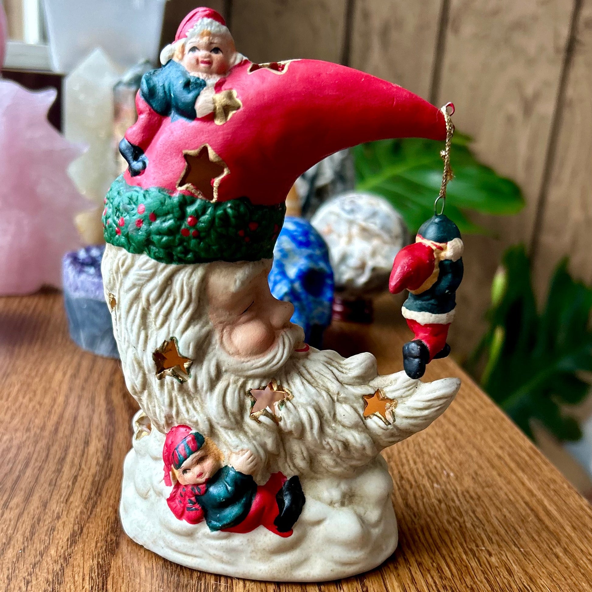 Decorative gnome figurine with a red hat on a wooden surface