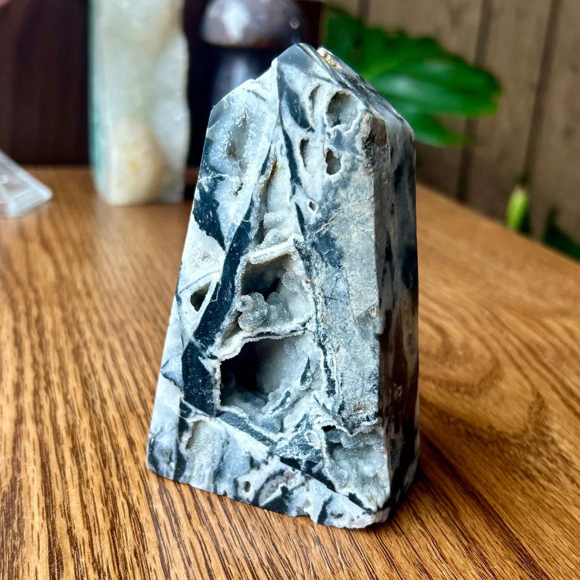 Decorative stone on a wooden surface with blurred background