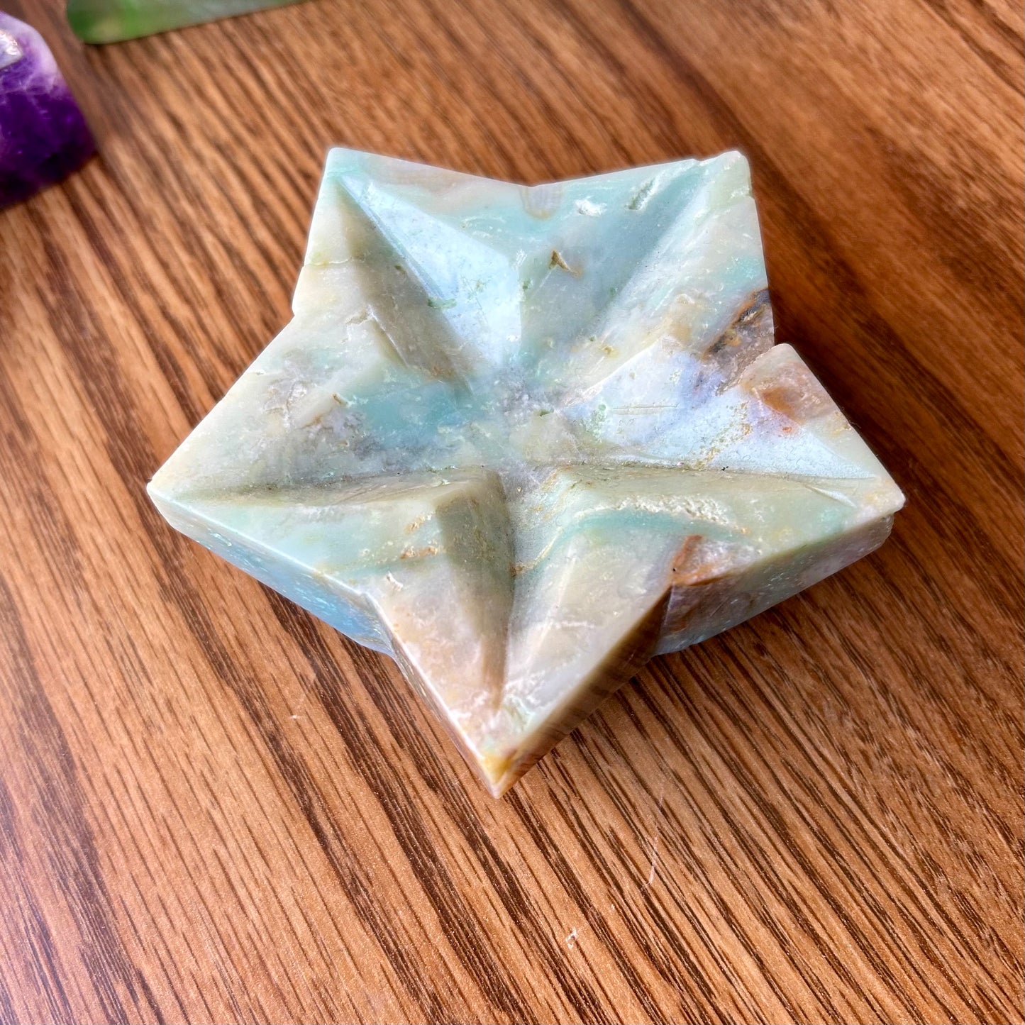 Star-shaped soap bar on a wooden surface
