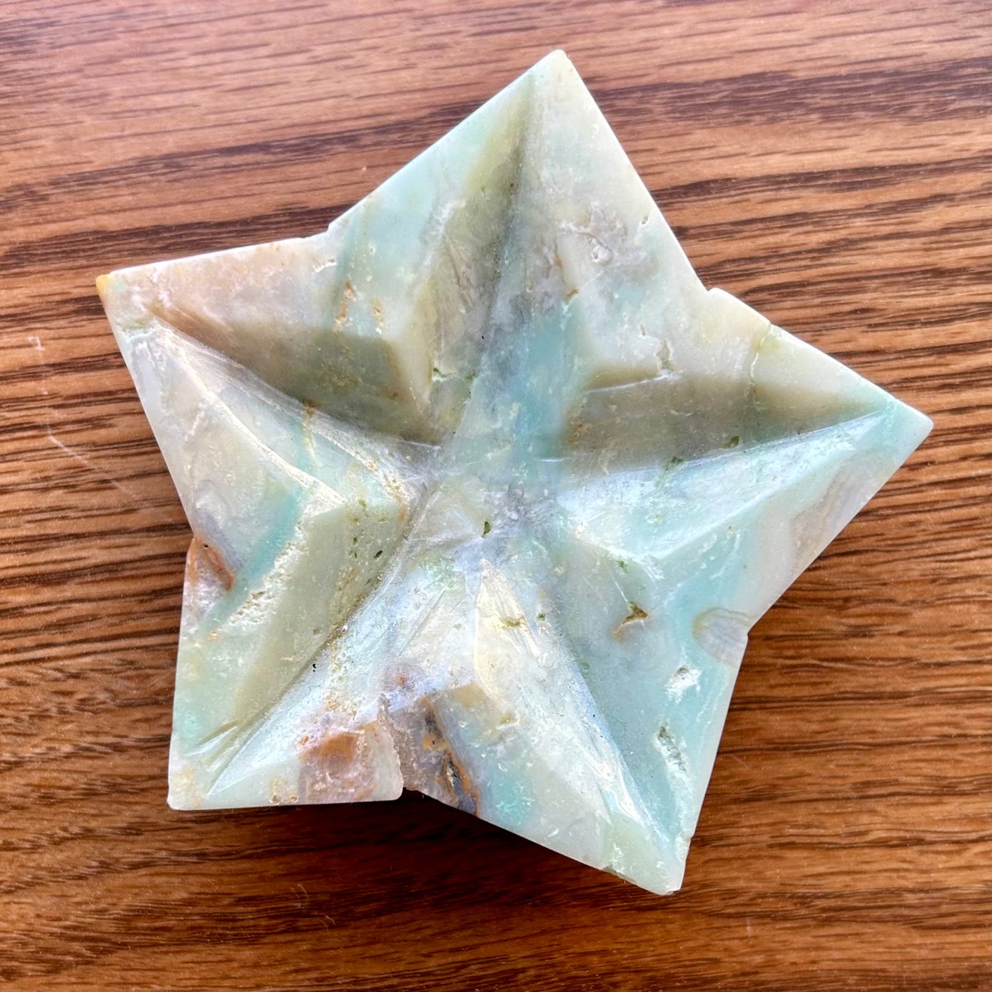 Star-shaped soap bar on a wooden surface