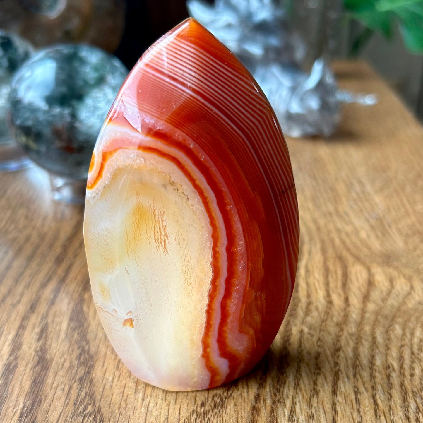 Polished agate stone on a wooden surface