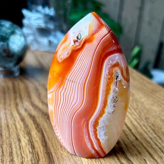 Agate stone on a wooden surface with a blurred background