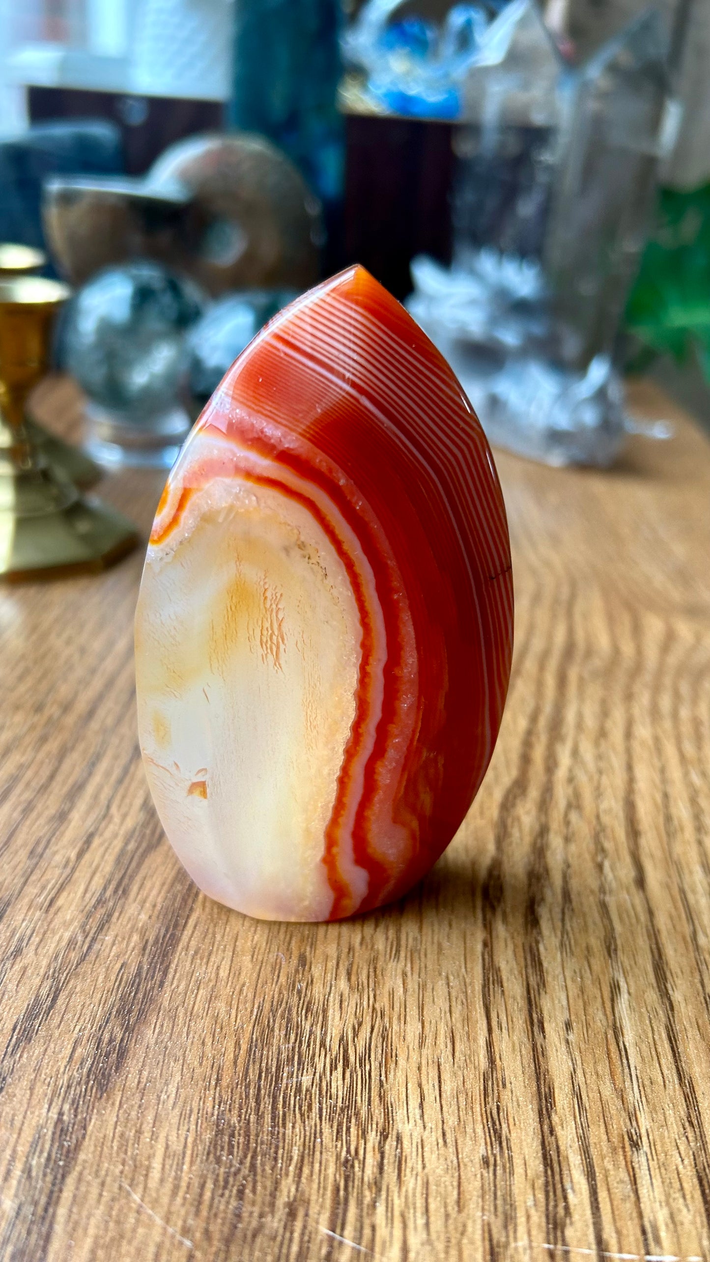 Polished agate stone on a wooden surface