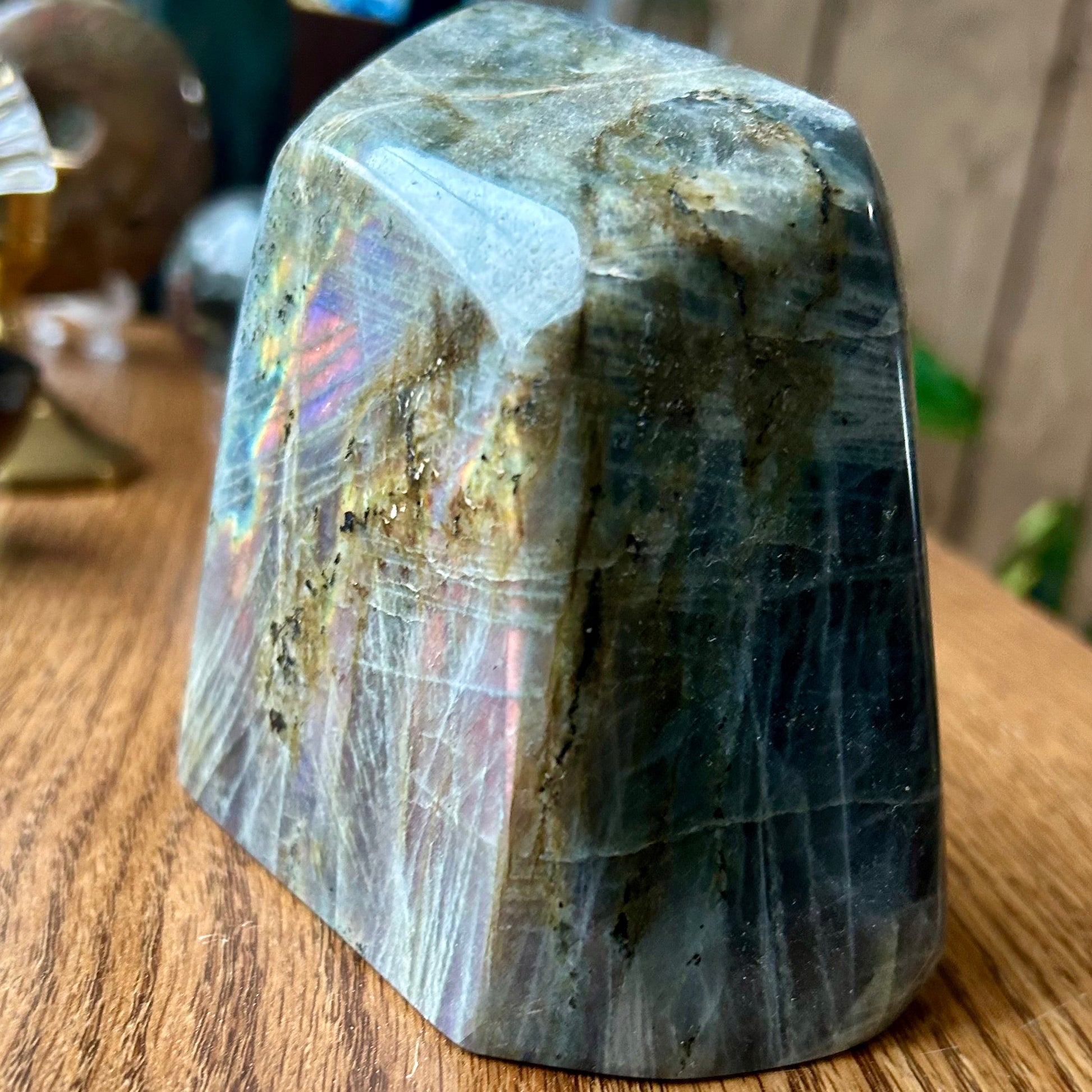 Polished stone on a wooden surface with blurred background