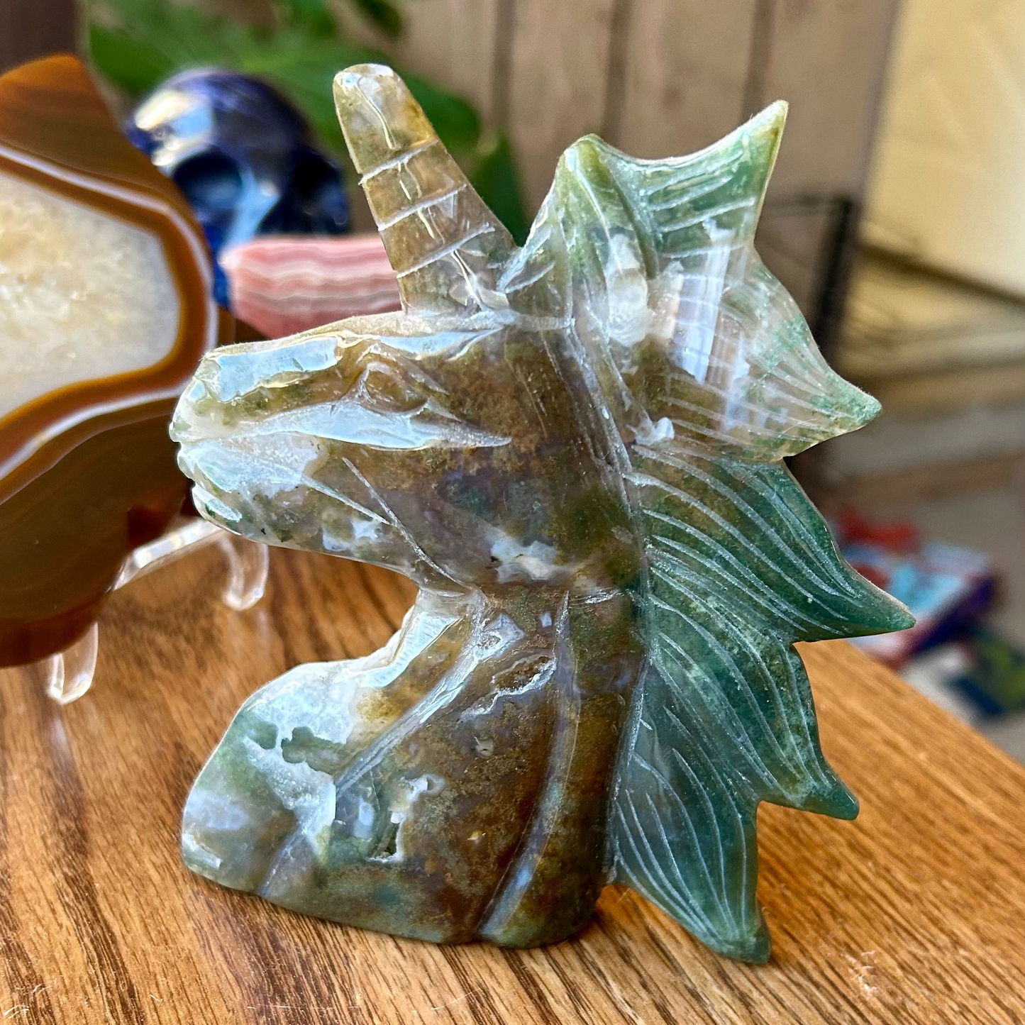 Decorative seashell sculpture on a wooden surface